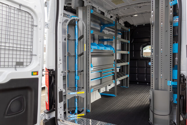 Adrian Next Generation steel shelving and HVAC tank rack installed in a Ford Transit commercial van.
