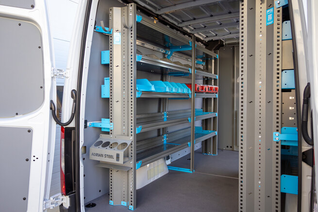 Adrian shelving with spray can holders and Milwaukee Packout Mounts.